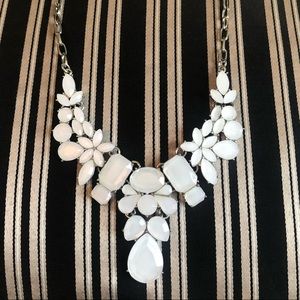 White jeweled necklace.